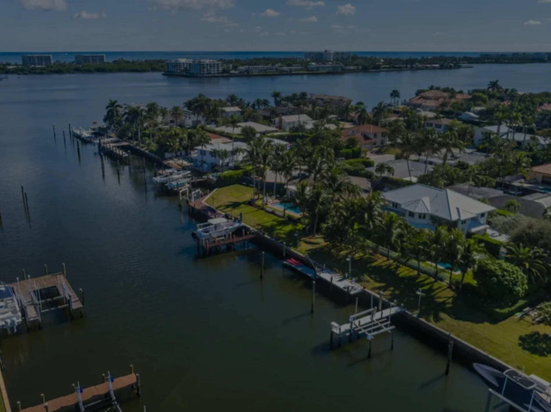 Aerial view of waterfront condos in Lake Worth, Florida with marina views of the Atlantic Ocean.